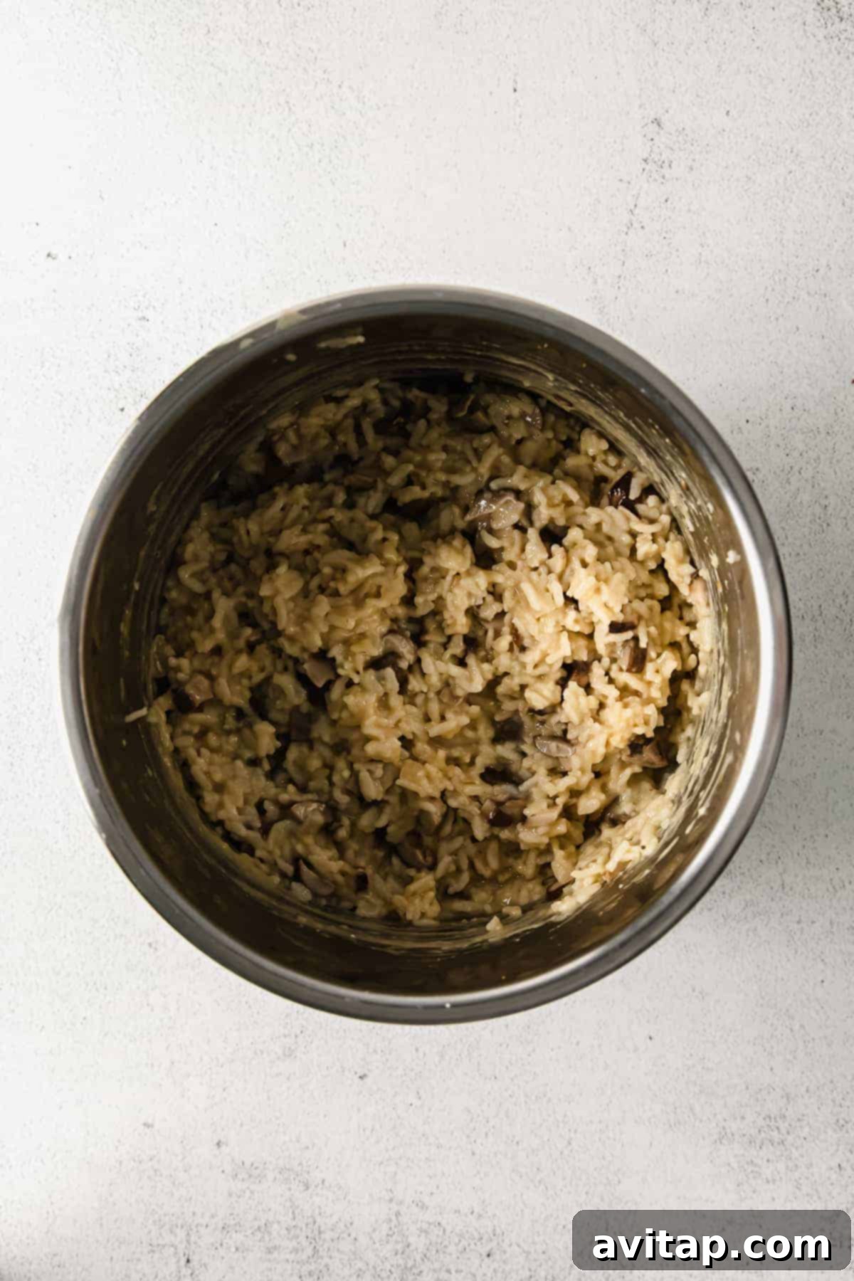 Effortless Creamy Mushroom Risotto 5 A serving of creamy Instant Pot mushroom risotto, perfect for any day of the week.