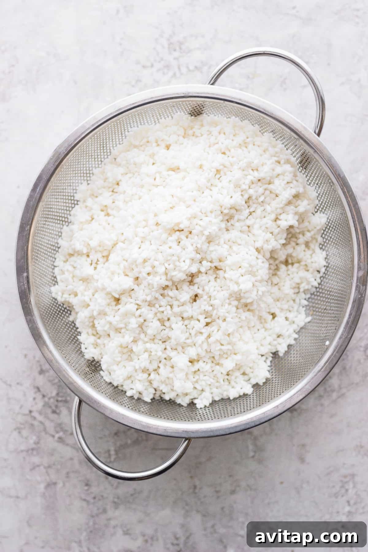 Sticky rice is a very versatile recipe to pair with many Asian-inspired dishes. Make sticky rice in your own kitchen with our step by step instructions. Enjoy! Sticky rice draining in a fine-mesh strainer after its hot water soak, ready for steaming.