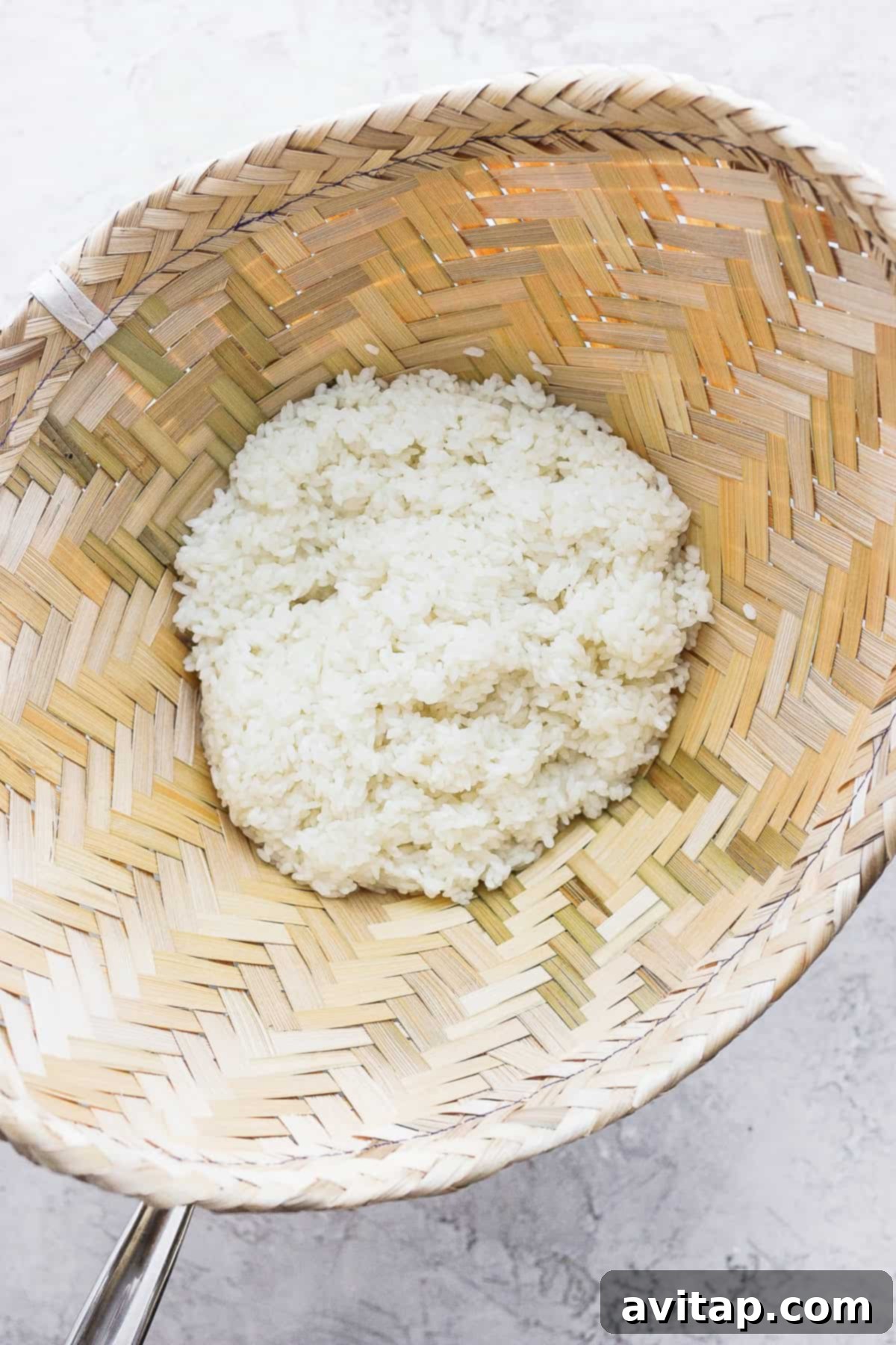 Sticky rice is a very versatile recipe to pair with many Asian-inspired dishes. Make sticky rice in your own kitchen with our step by step instructions. Enjoy! Freshly steamed sticky rice inside a bamboo basket, showcasing its perfect, translucent texture.