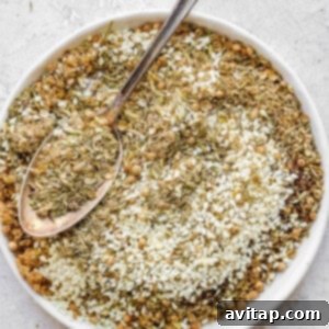 A small bowl of homemade Za'atar seasoning with sesame seeds visible.