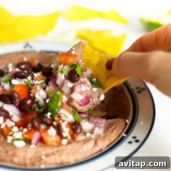 A square image of Mexican black bean hummus in a bowl, perfect for sharing on social media or pinning for later.