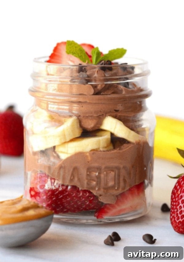 Healthy Chocolate Peanut Butter Mousse Parfait Healthy chocolate peanut butter mousse served as a beautiful parfait with fresh fruit, emphasizing its appealing presentation