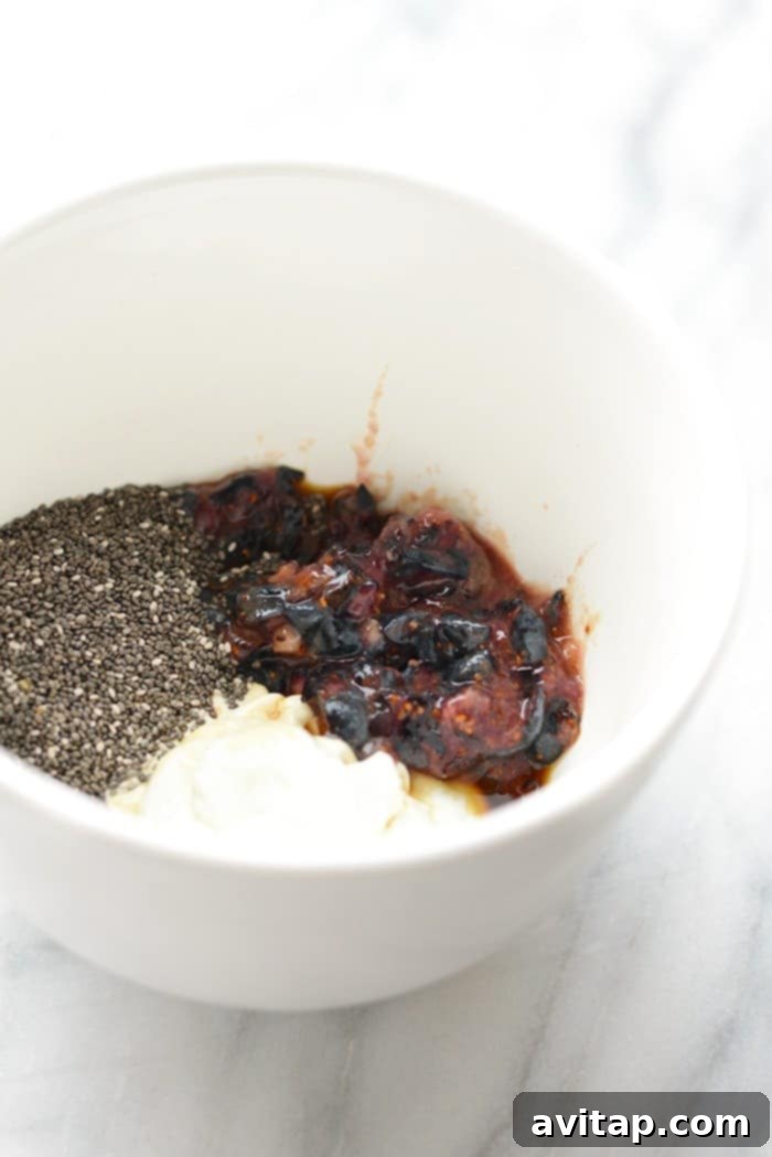 A bowl containing all the mixed ingredients for chia seed pudding before chilling.