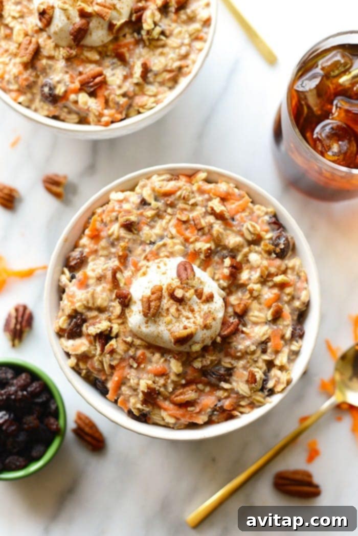 No-Bake Carrot Cake Oats 4 A visually appealing bowl of carrot cake overnight oats, adorned with various delicious toppings, emphasizing the customizable and delightful nature of this healthy breakfast.
