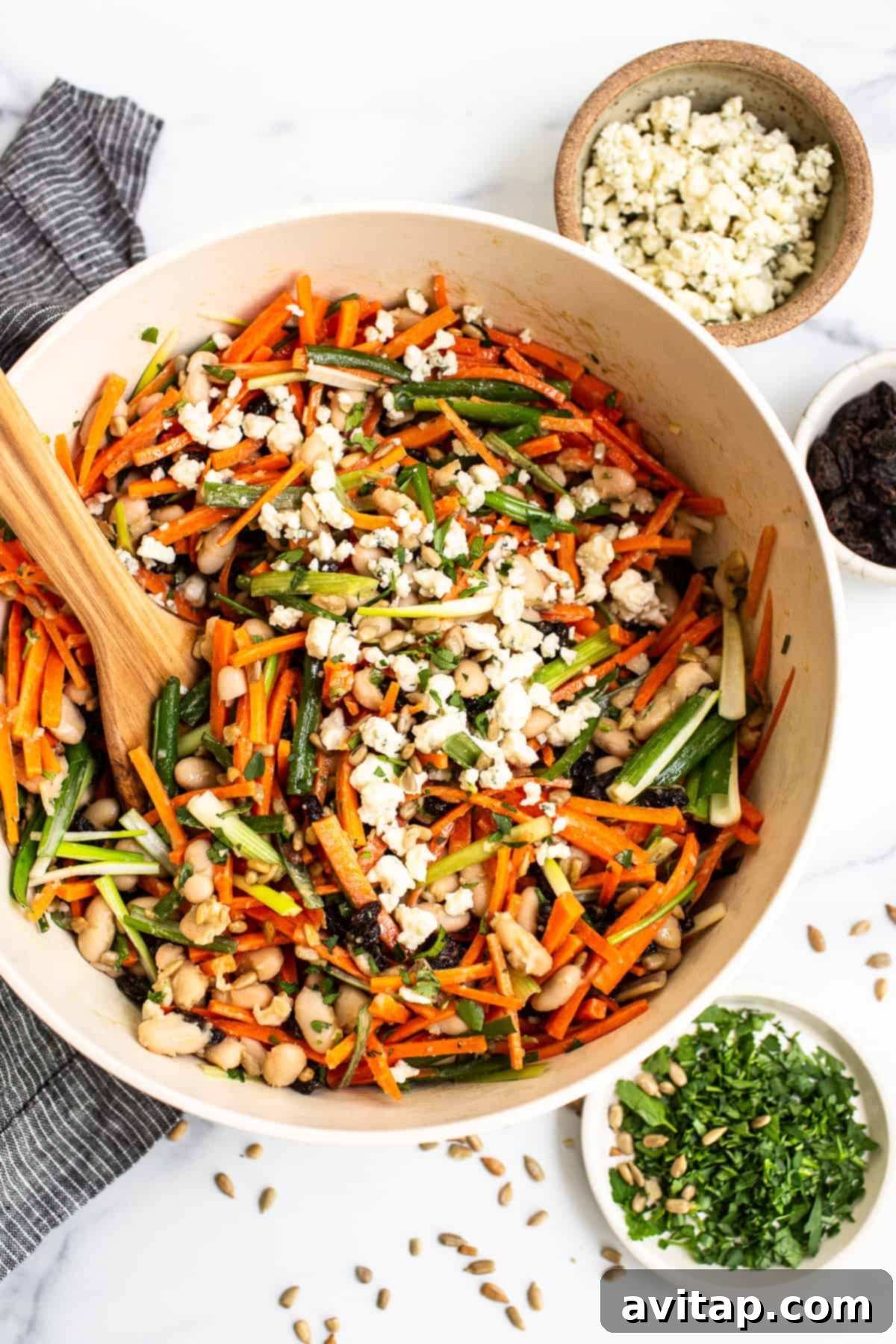 Delicious French Carrot Salad with honey mustard dressing in a rustic bowl, ready to serve.