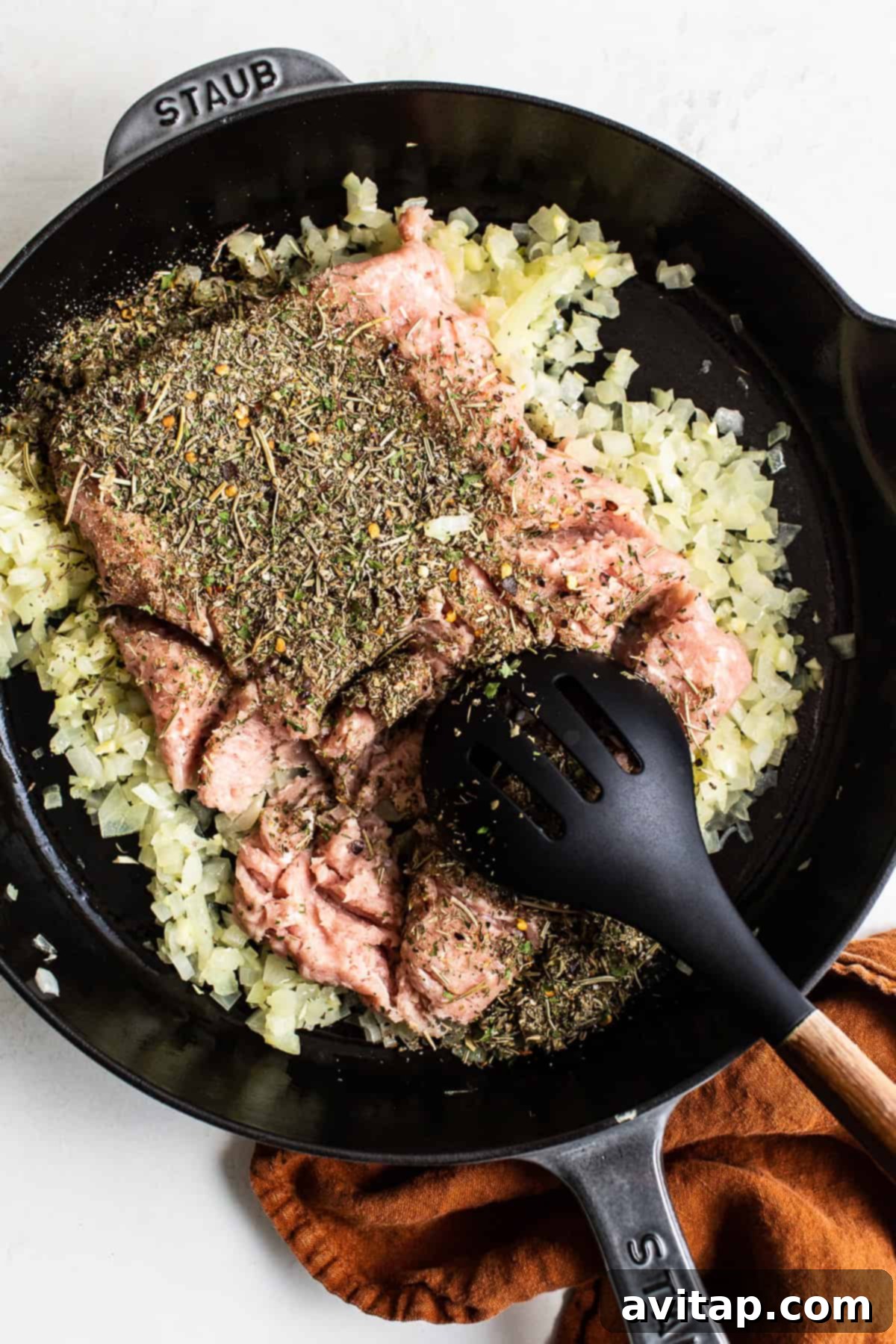 Ground Turkey and Aromatics in Skillet Ingredients for ground turkey pasta simmering in a skillet.