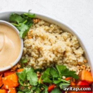 Island Coconut Quinoa 6 A vibrant bowl of coconut quinoa with carrots and a delicious dipping sauce, perfect for a healthy and satisfying meal.