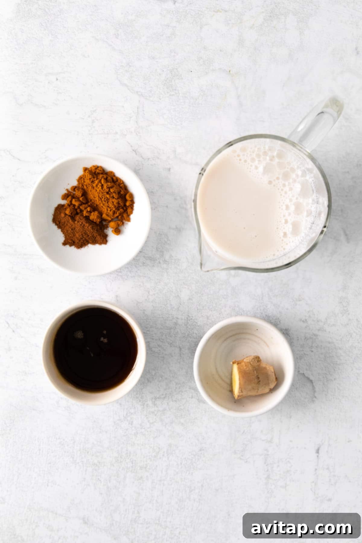 Ingredients for golden milk latte on a counter