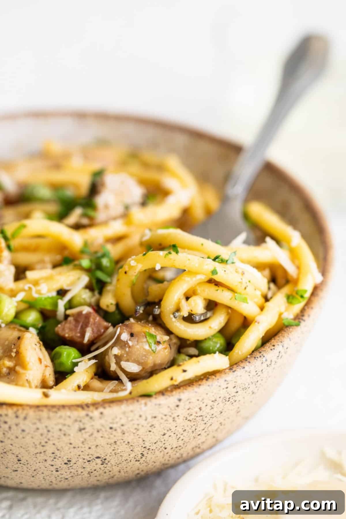 A perfectly plated bowl of chicken carbonara, ready to be enjoyed.