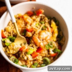 A square image of a delicious bowl of shrimp fried rice.