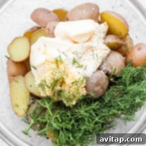 Dressed potatoes in a bowl, ready for the salad.