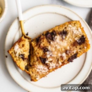 A delicious slice of Kodiak Cakes banana bread, showcasing its moist texture and chocolate chips.