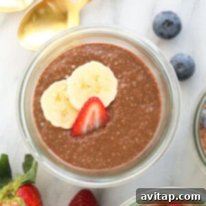 Three jars of protein-packed chia seed pudding with berries and bananas.