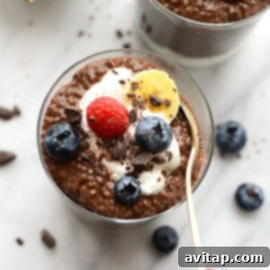 Chocolate chia seed pudding with berries and whipped cream.