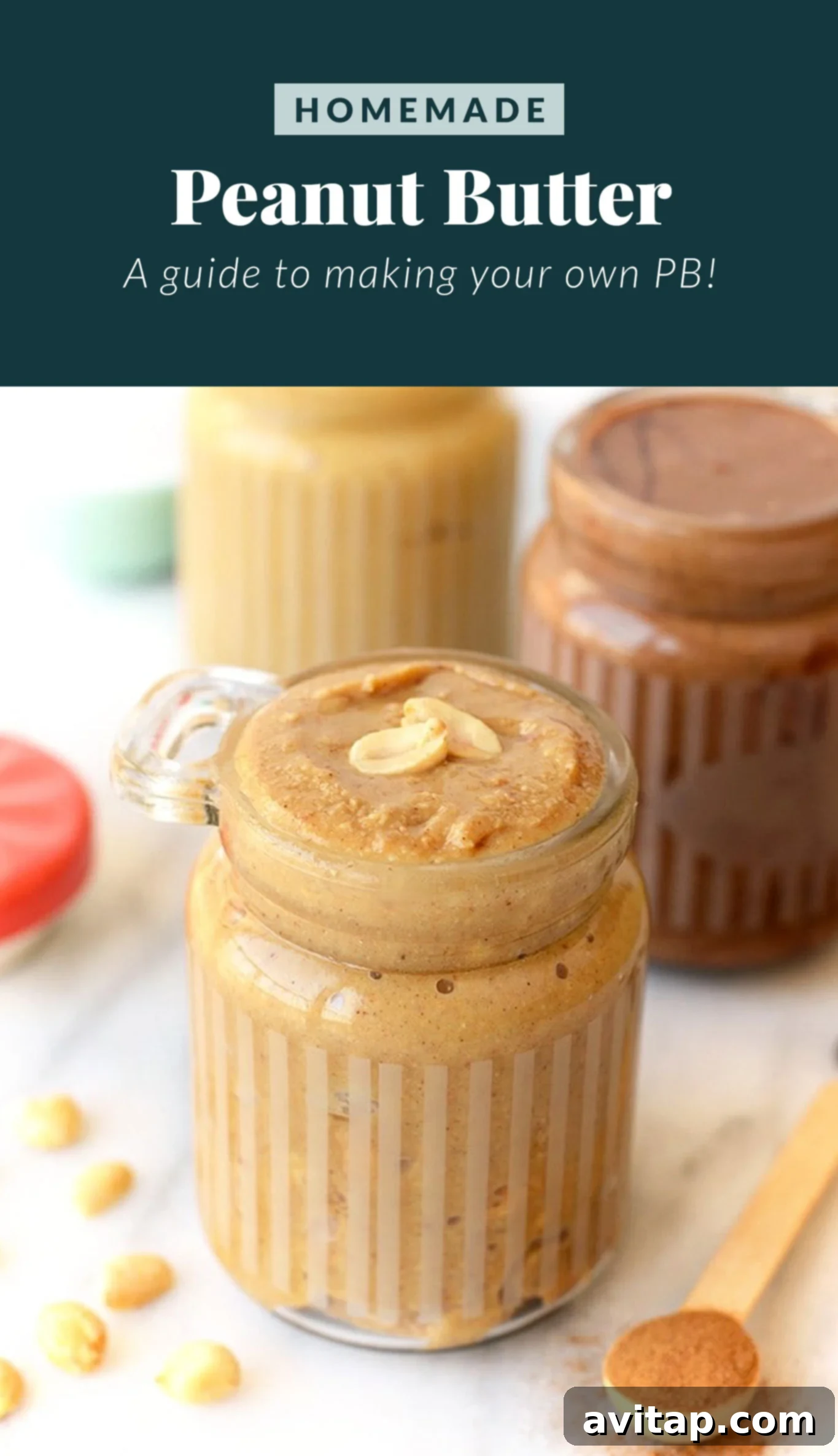 Homemade peanut butter in a jar with peanuts scattered around