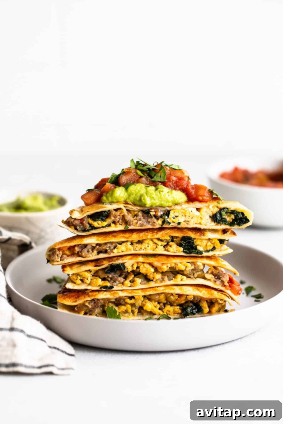 Enjoy a stack of convenient make-ahead breakfast quesadillas. Delicious make-ahead freezer breakfast quesadillas, perfectly stacked and ready to enjoy.