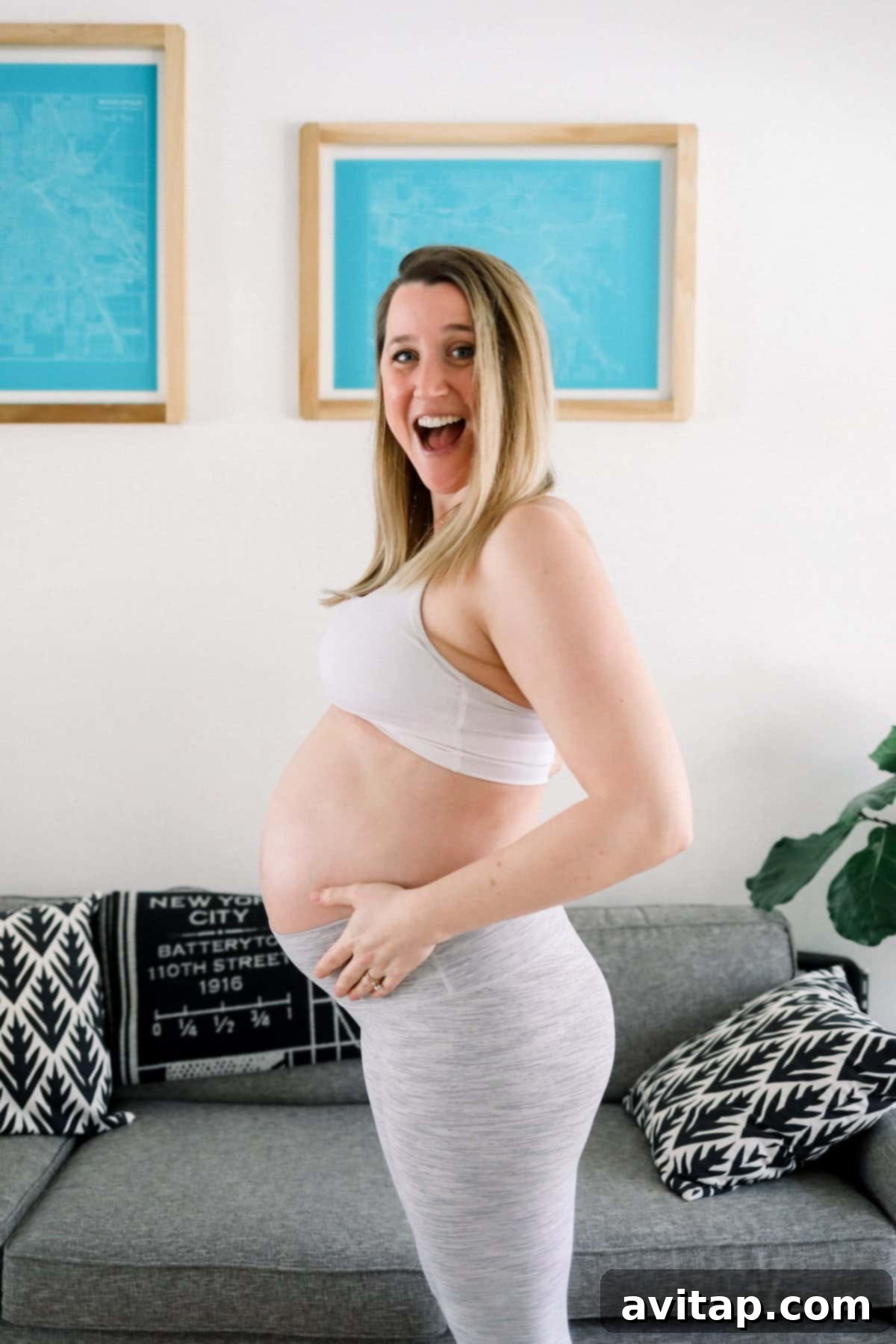 Comfortable Lululemon Outfit for Pregnancy Pregnant woman comfortably stretching in Lululemon activewear, featuring a supportive top and flexible leggings.