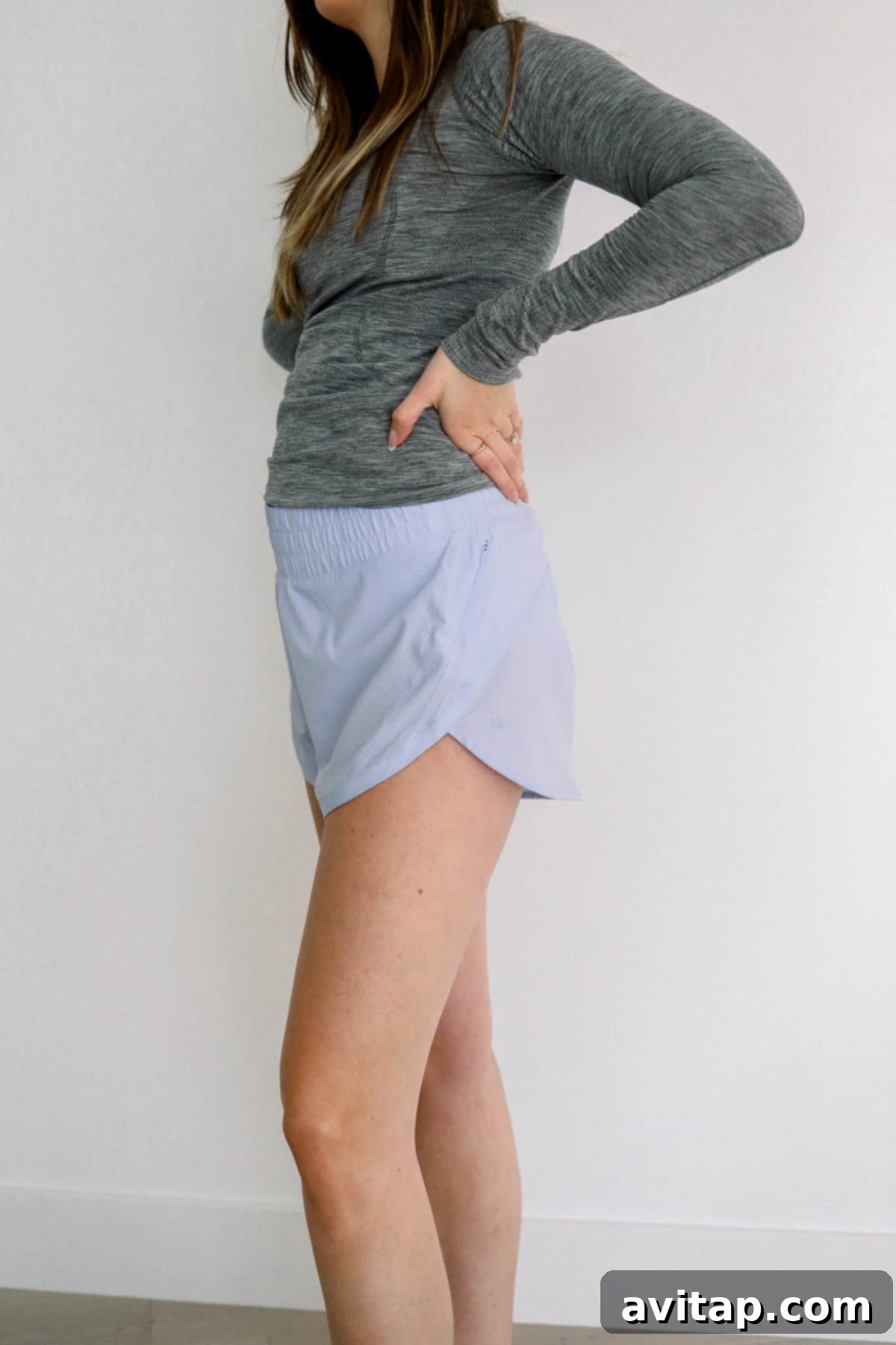 Lululemon Track That Shorts for Pregnancy Woman wearing Lululemon Track That shorts, highlighting their loose fit and comfortable waistband.