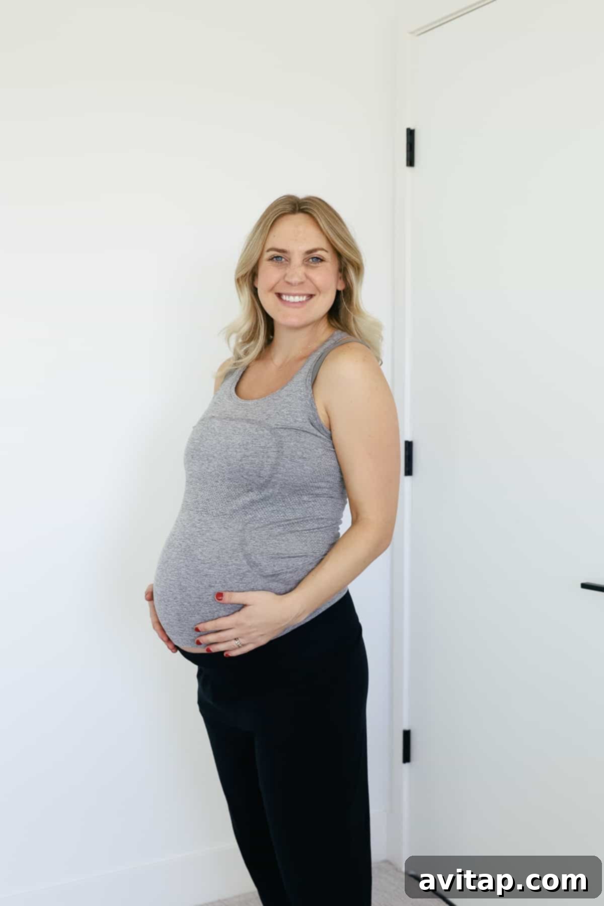 Lululemon Maternity Postpartum Favorites 2 Pregnant woman wearing a Lululemon Swiftly Tech Racerback Tank, perfect for workouts and everyday comfort.