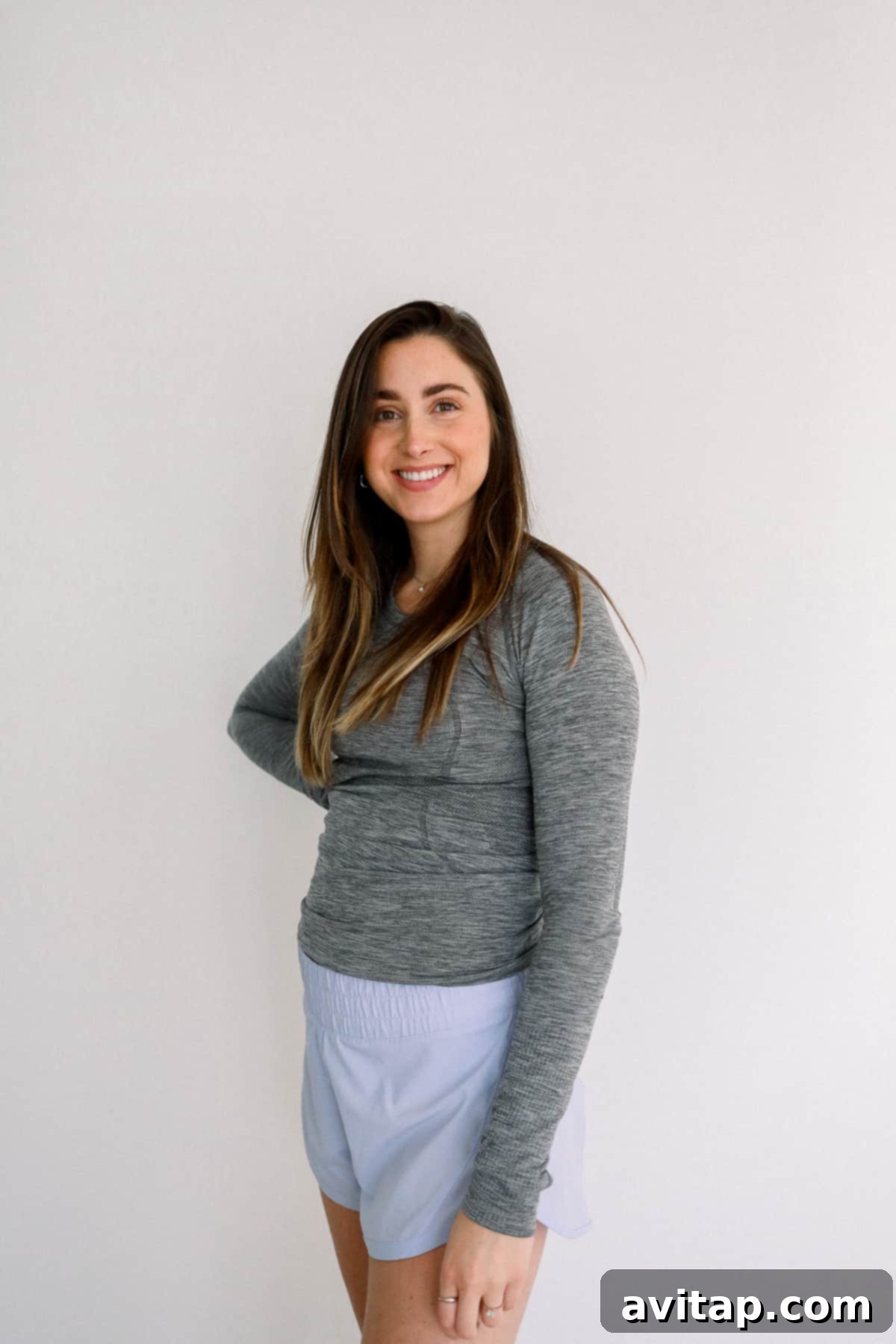 Lululemon Long Sleeve for Maternity Woman wearing a Lululemon Swiftly Tech Long Sleeve shirt, offering excellent coverage and flexibility.