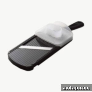 A high-quality ceramic mandoline slicer on a clean background, showcasing its sharp blade and design.