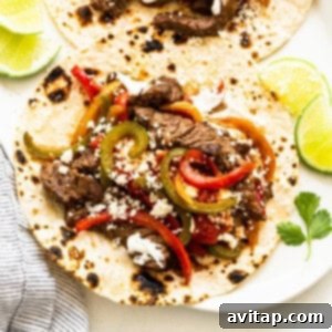 A serving of sizzling steak fajitas, beautifully presented and ready to enjoy.