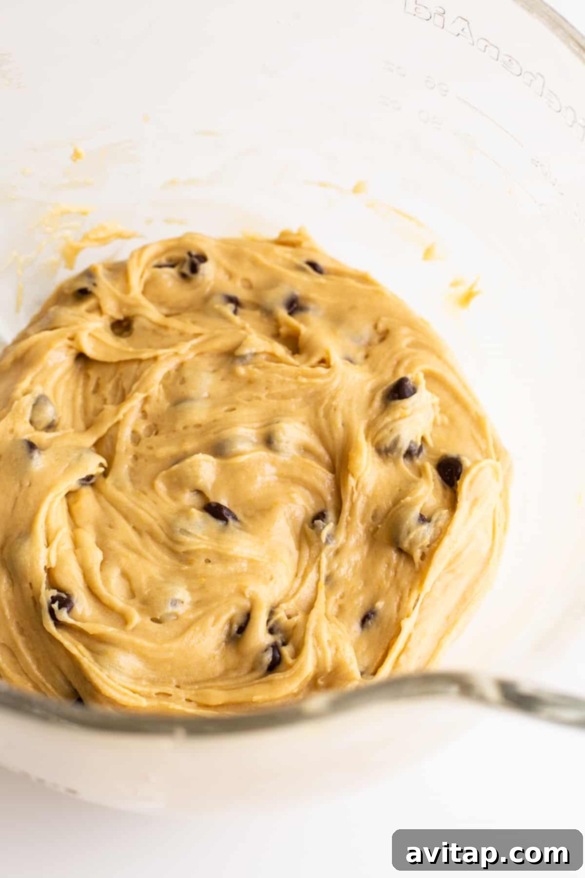 Maple-Infused Chocolate Chip Blondie Bars 5 Close-up view of the rich, thick blondie batter in a stainless steel mixing bowl, ready for baking.