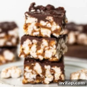 A stack of chocolate graham cracker bars on a plate, showcasing the final delicious product.