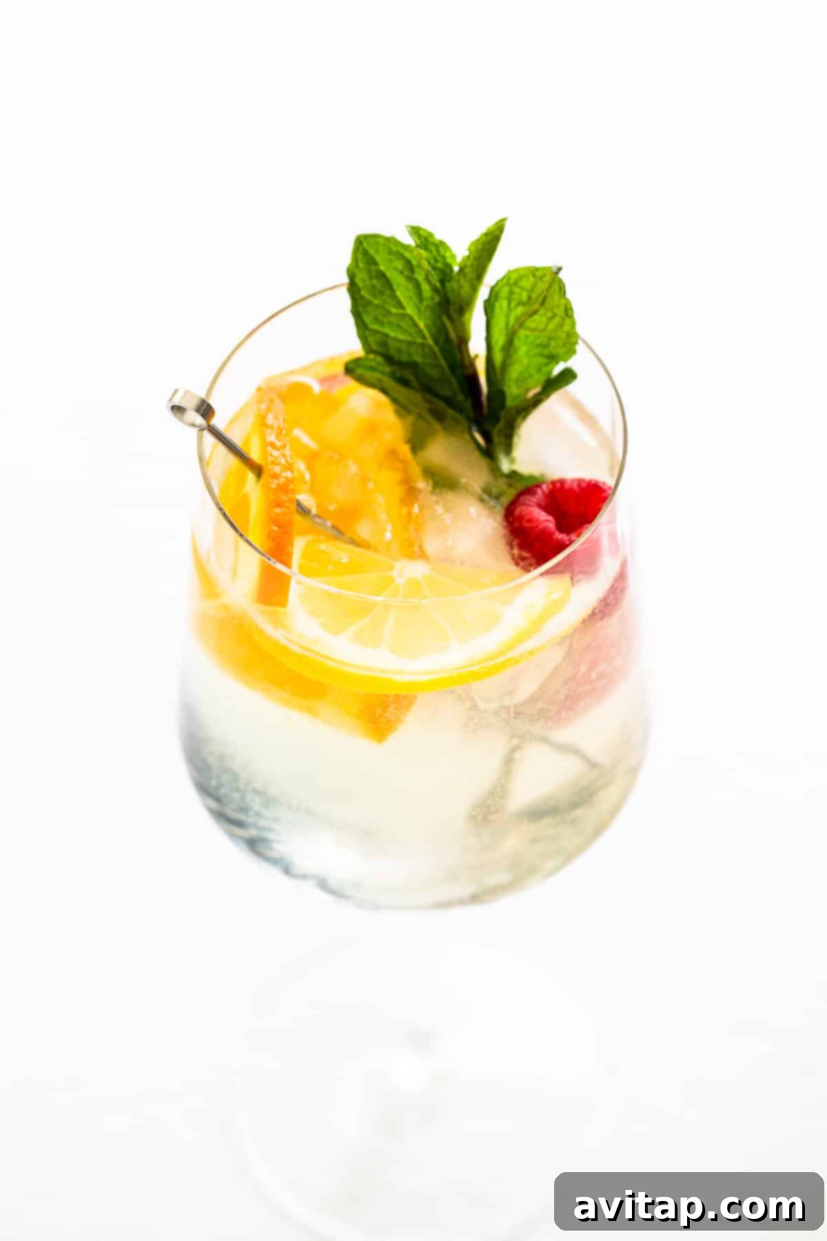 White wine spritzer in a glass with fresh mint, beautifully prepared and ready to serve.