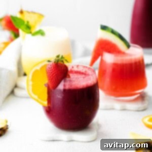 Three refreshing wine slushies in elegant glasses, perfect for a hot day.