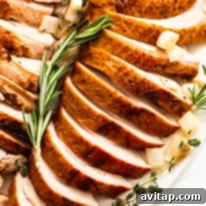 Smoked turkey breast sliced on a plate.