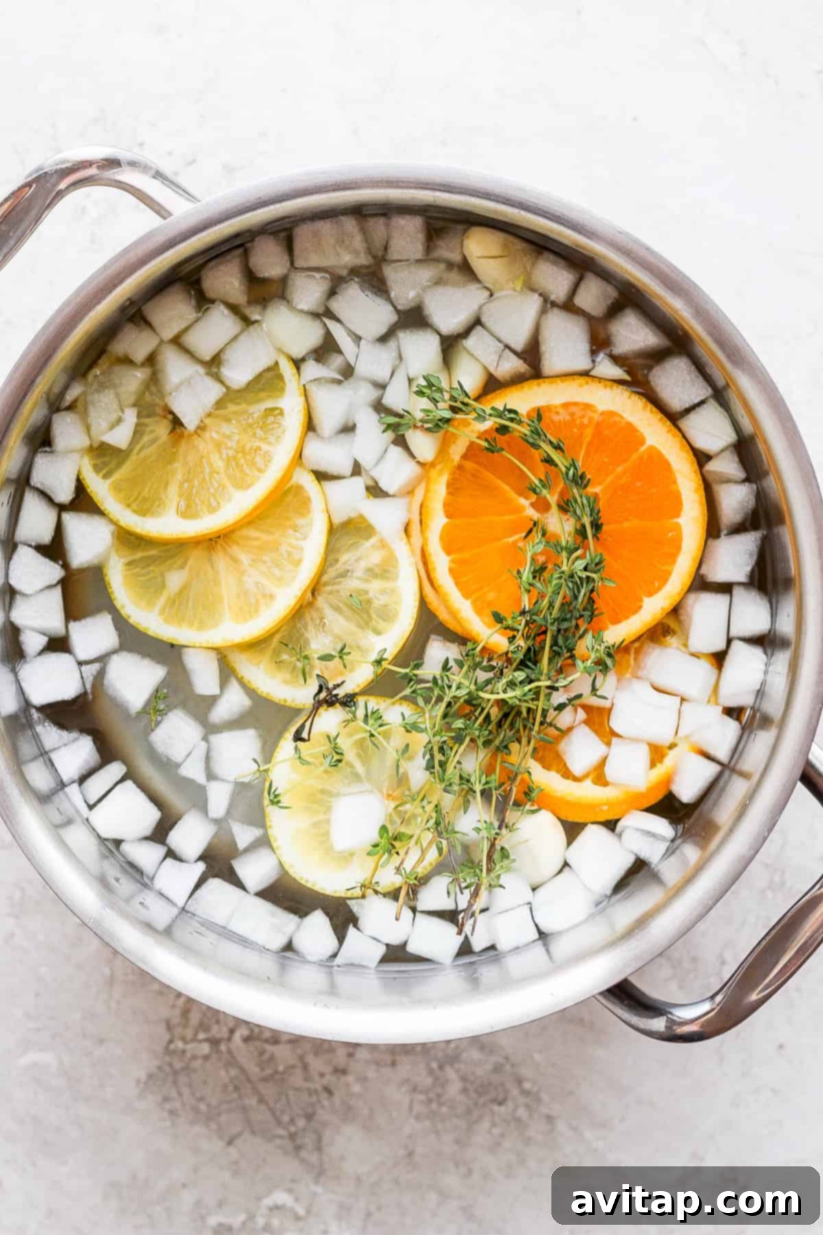 Chicken brining in pot. A whole chicken submerged in a flavorful brine solution within a large pot, soaking up all the delicious ingredients.