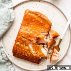 Flaked smoked salmon on a plate, ready to be served and enjoyed.