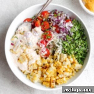 Smoky Sweet Cob 3 Street corn salad recipe in a bowl, a vibrant side dish.