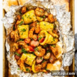 Grilled shrimp foil packets full of veggies and shrimp.