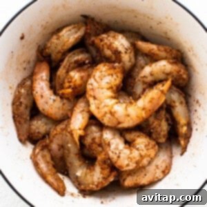 Shrimp sitting in old bay seasoning.