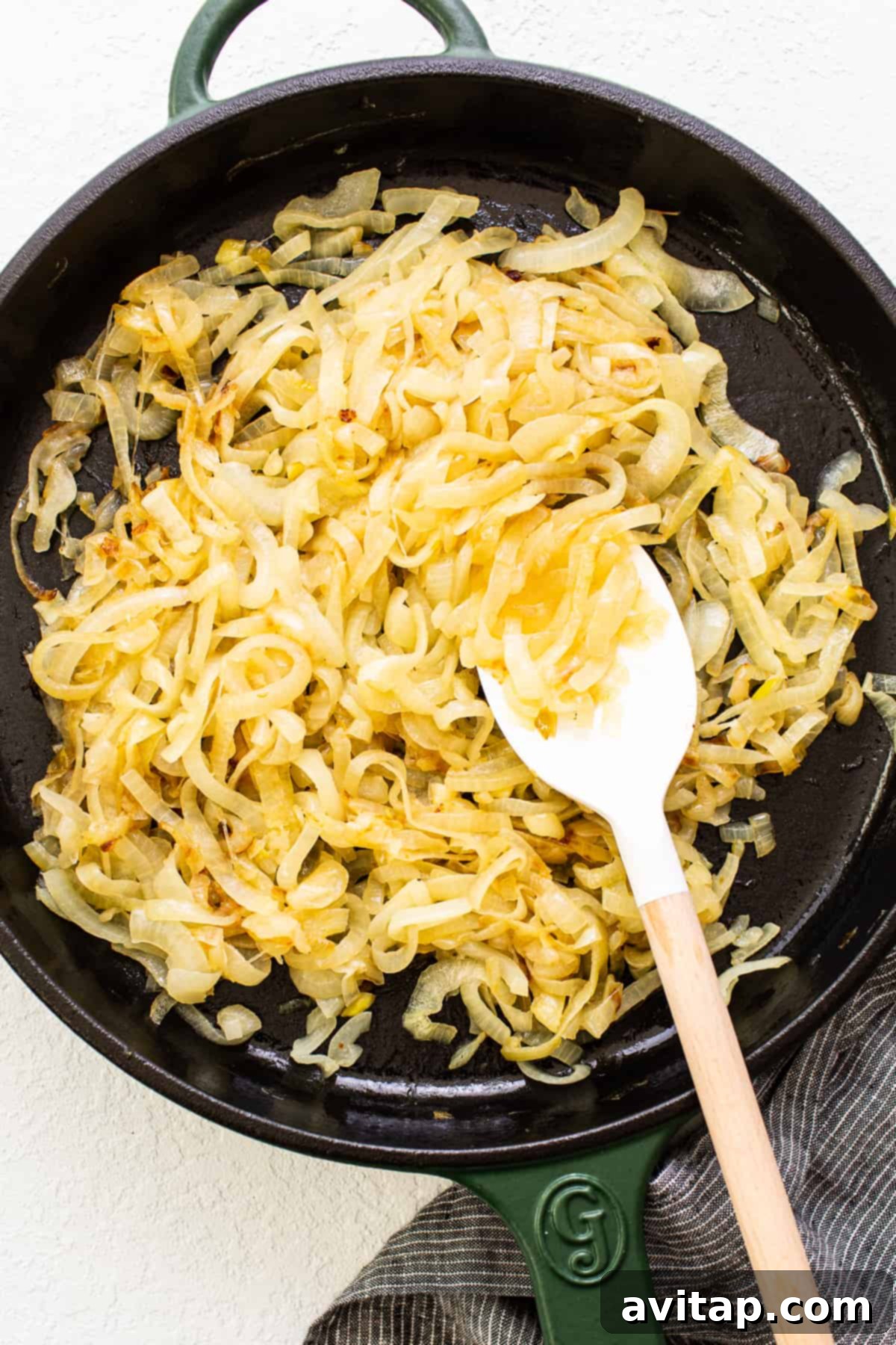 Effortless Golden Caramelized Onions 6 Caramelized onions in a skillet after 30 minutes of cooking, showing the transitional stage before deep browning.