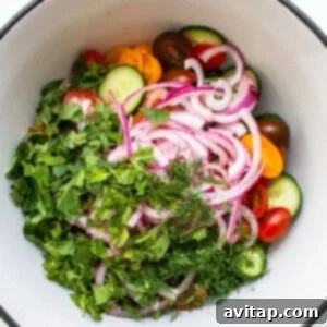 Add fresh mint and onions to tomatoes.