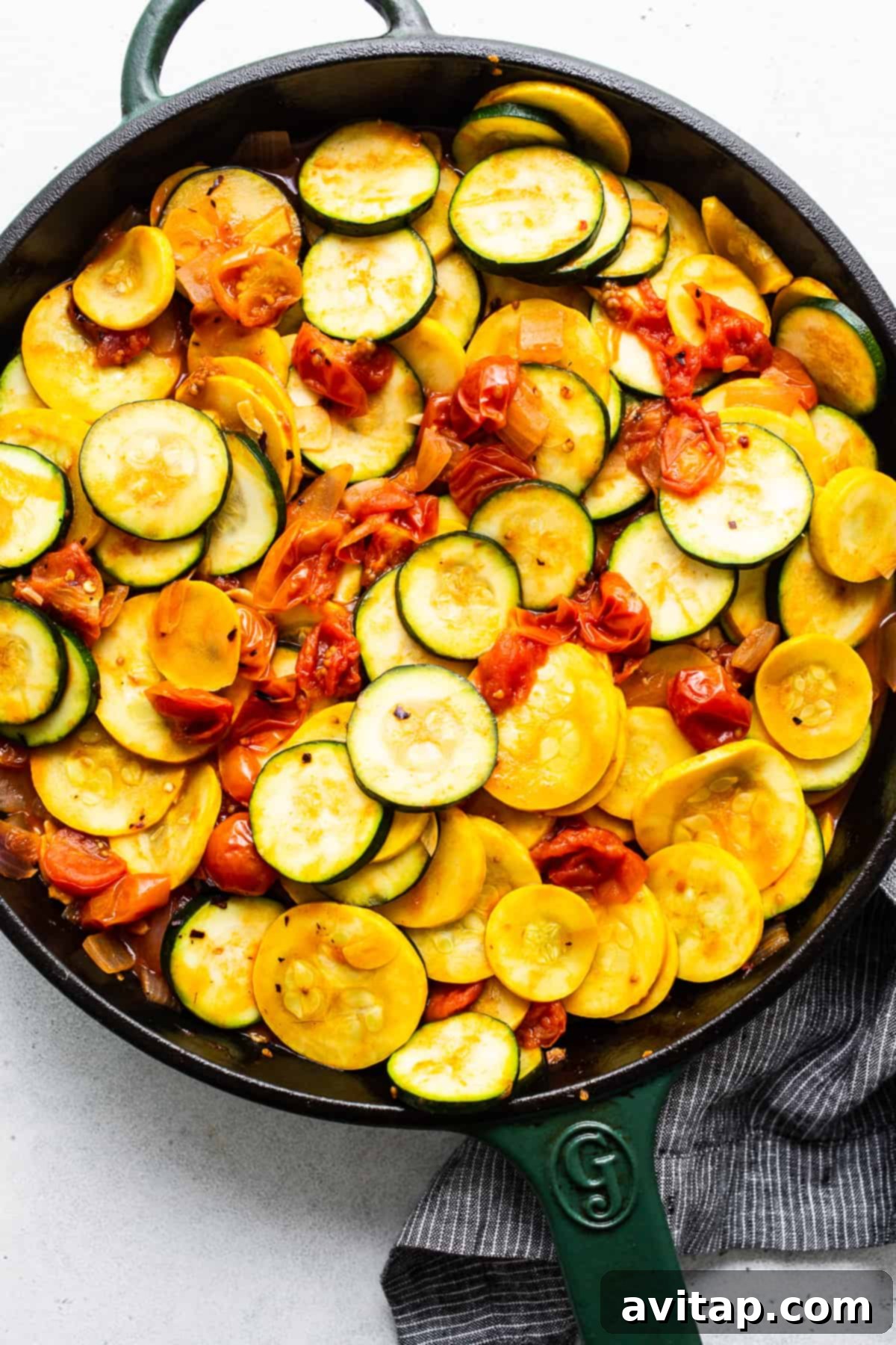 Zucchini and yellow squash perfectly tossed in a skillet with a flavorful sauce.
