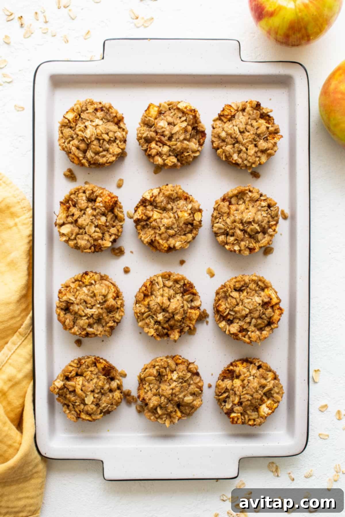 Platter of perfectly baked mini apple crisps, golden brown and ready to serve.