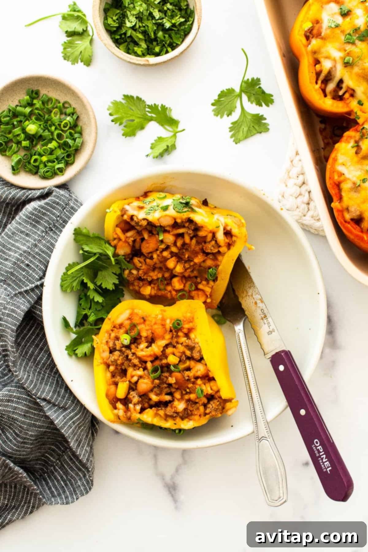 Stuffed pepper cut in half on a plate.