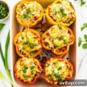 Mexican stuffed peppers in a baking dish.