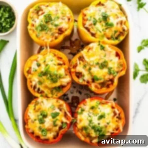 Mexican stuffed peppers in a baking dish.