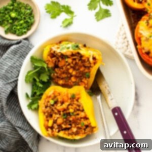 Mexican stuffed peppers on a white plate.