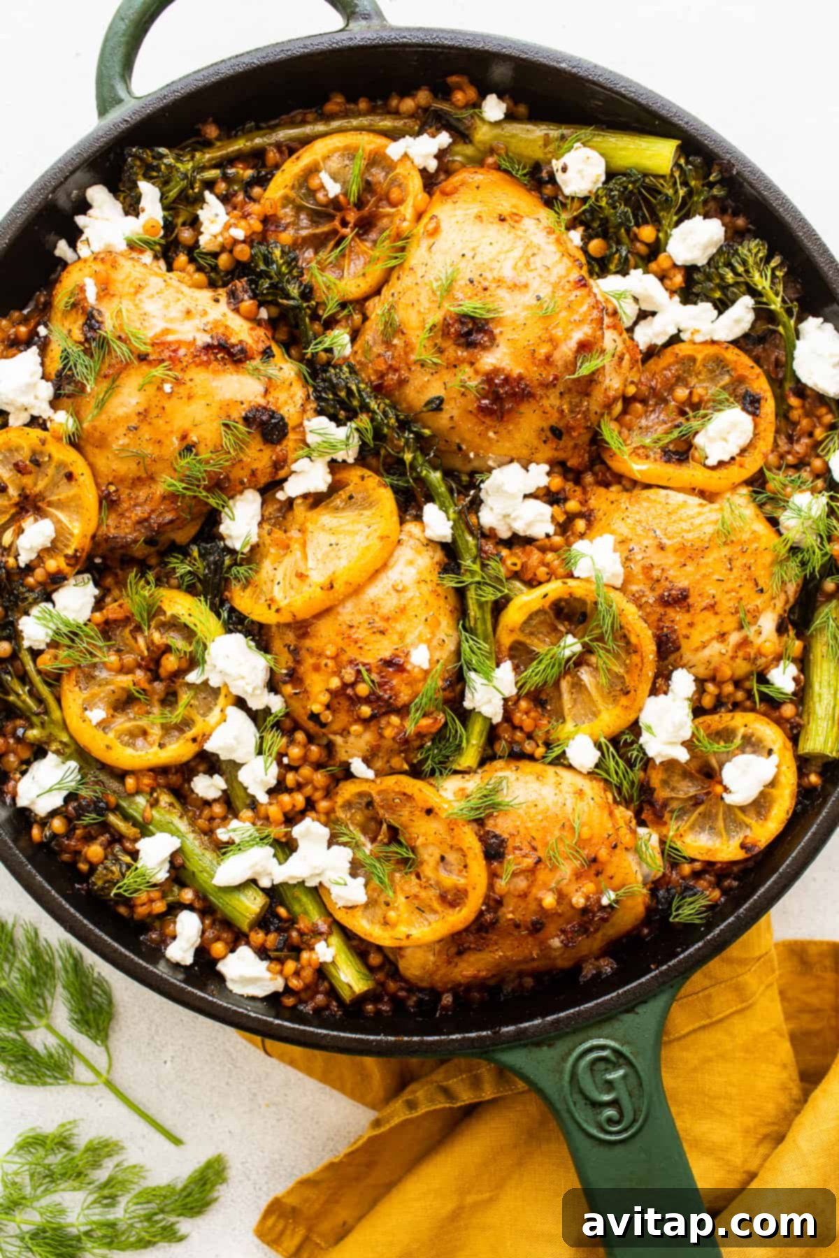 Beautifully plated Lemon Chicken Skillet topped with fresh goat cheese and dill.
