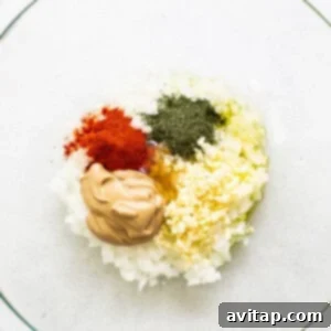 A bowl filled with spices, honey, and mustard for the marinade.