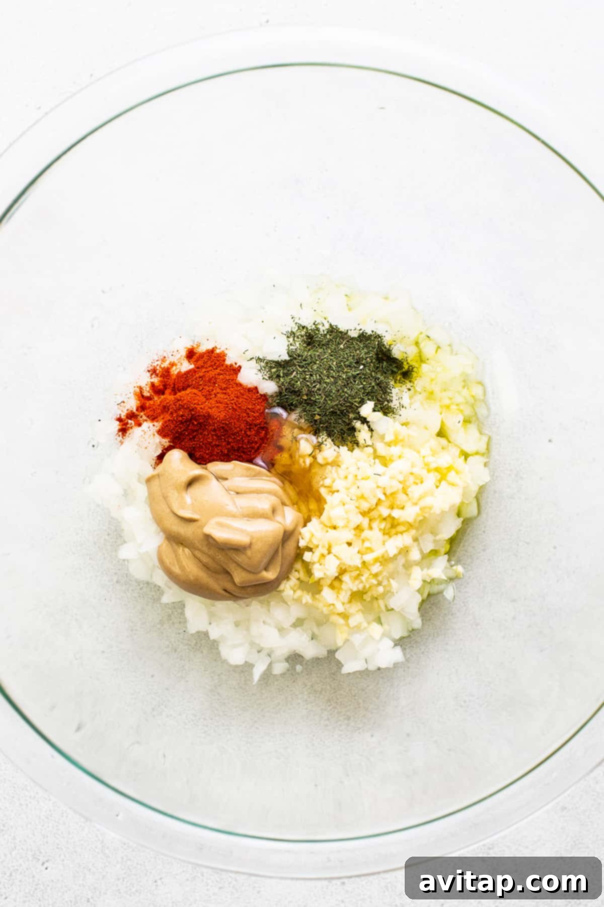 Close-up of a flavorful lemon chicken marinade in a mixing bowl.