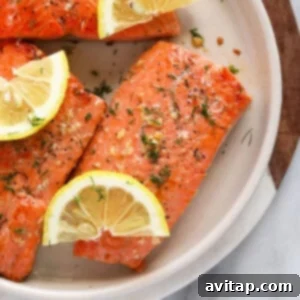 Golden Crusted Salmon 3 Raw salmon fillet on a plate, ready for cooking.