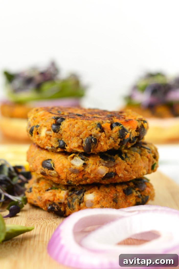 A stack of perfectly prepared sweet potato burgers, ready for serving with your favorite toppings.