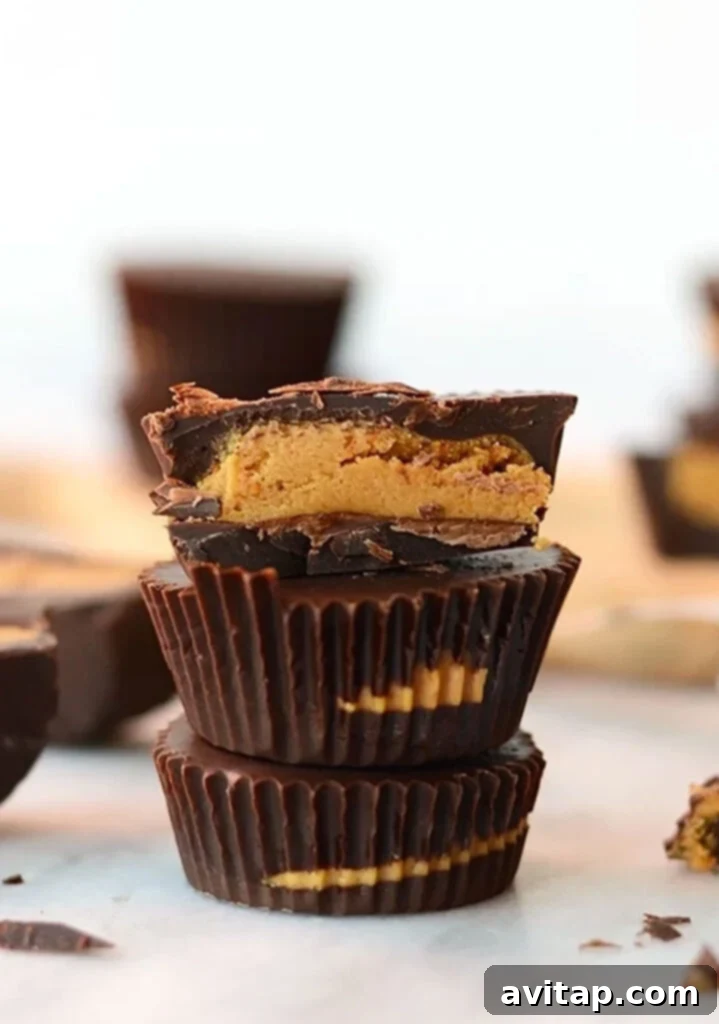 A stack of delicious protein peanut butter cups, showcasing their layers of chocolate and creamy peanut butter filling.